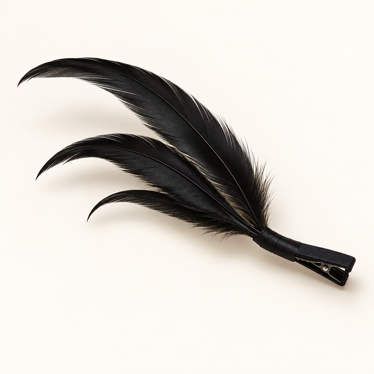 Noche Noir: Three slender black feathers in a diagonal sweep.