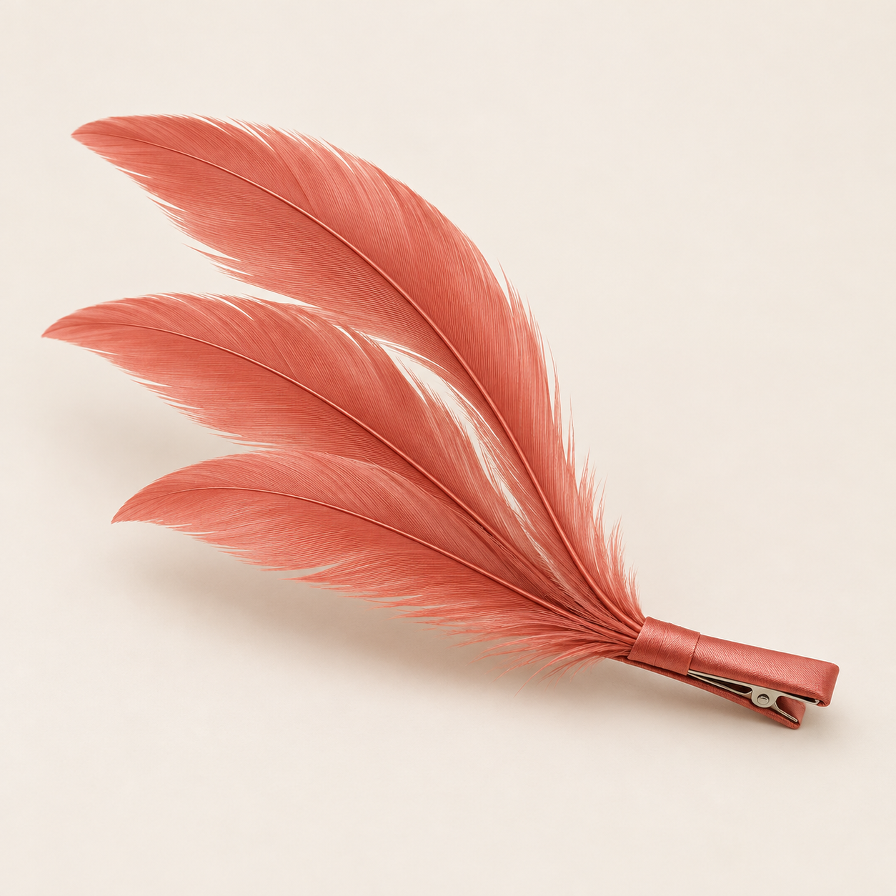 Rosa Ember: Three slender coral rose feathers in a diagonal sweep.